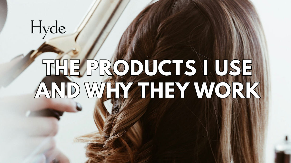 Hyde Salon stylist holding recommended hair products for clients.